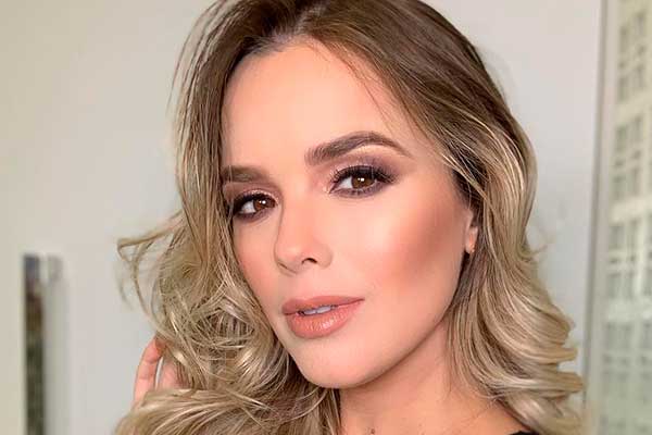 Thaeme aposta em vestido justinho e exibe barrigão de 7 meses