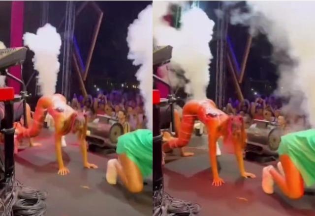 Anitta aparece em show com as mãos no chão e a bunda para cima enquanto jatos de fumaça saem do palco