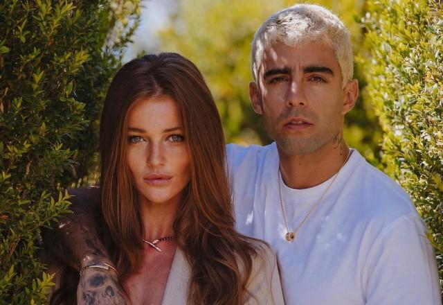 Cintia Dicker e Pedro Scooby posam abraçados em jardim