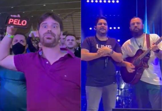 Fã segurando celular com mensagem à esquerda; Dupla Jorge e Mateus durante show à direita