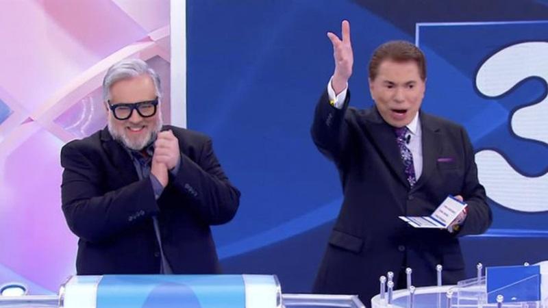 Leão Lobo ao lado de Silvio Santos.