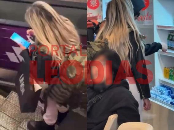 Liziane Gutierrez distraída no aeroporto 